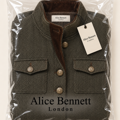 Vivienne | Herringbone Contrast-Trim Jacket – compactly folded Alice Bennett London packaging