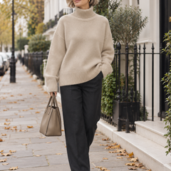 Amaya beige oversized turtleneck sweater worn by a mature woman on a London street