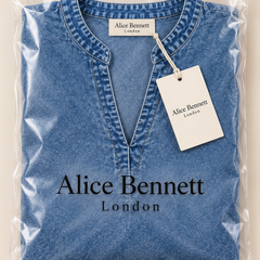Ashley blue textured V-neck blouse folded in Alice Bennett London branded packaging