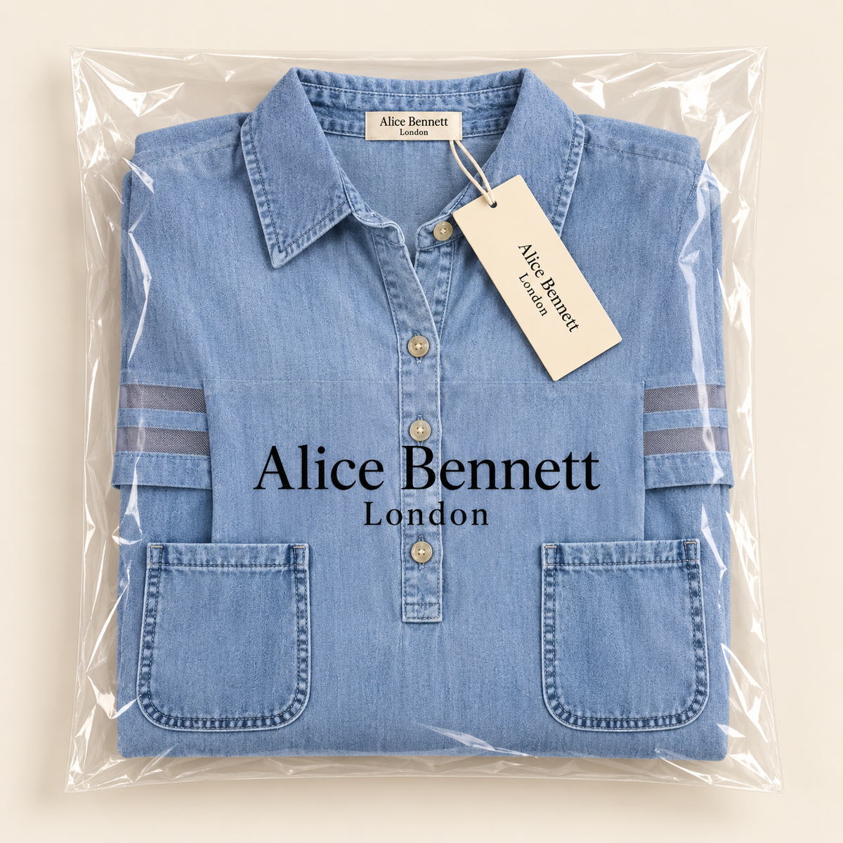 Brittany light-blue denim dress folded in Alice Bennett London branded packaging