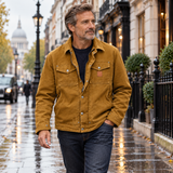 Carh men's Berwick jacket in Brown worn by a mature male model walking in London