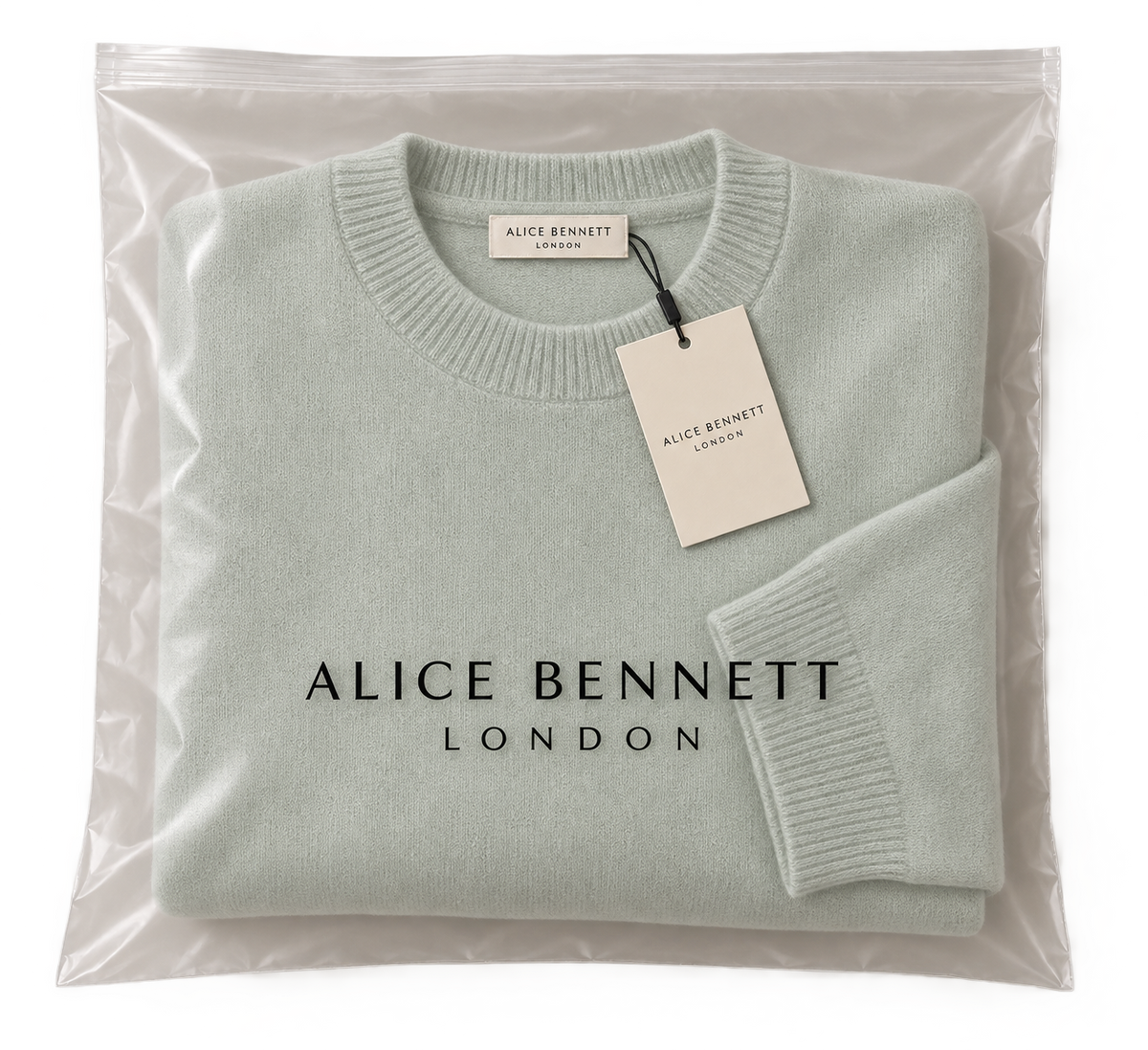 Pale mint classic crew-neck sweater in Alice Bennett London packaging