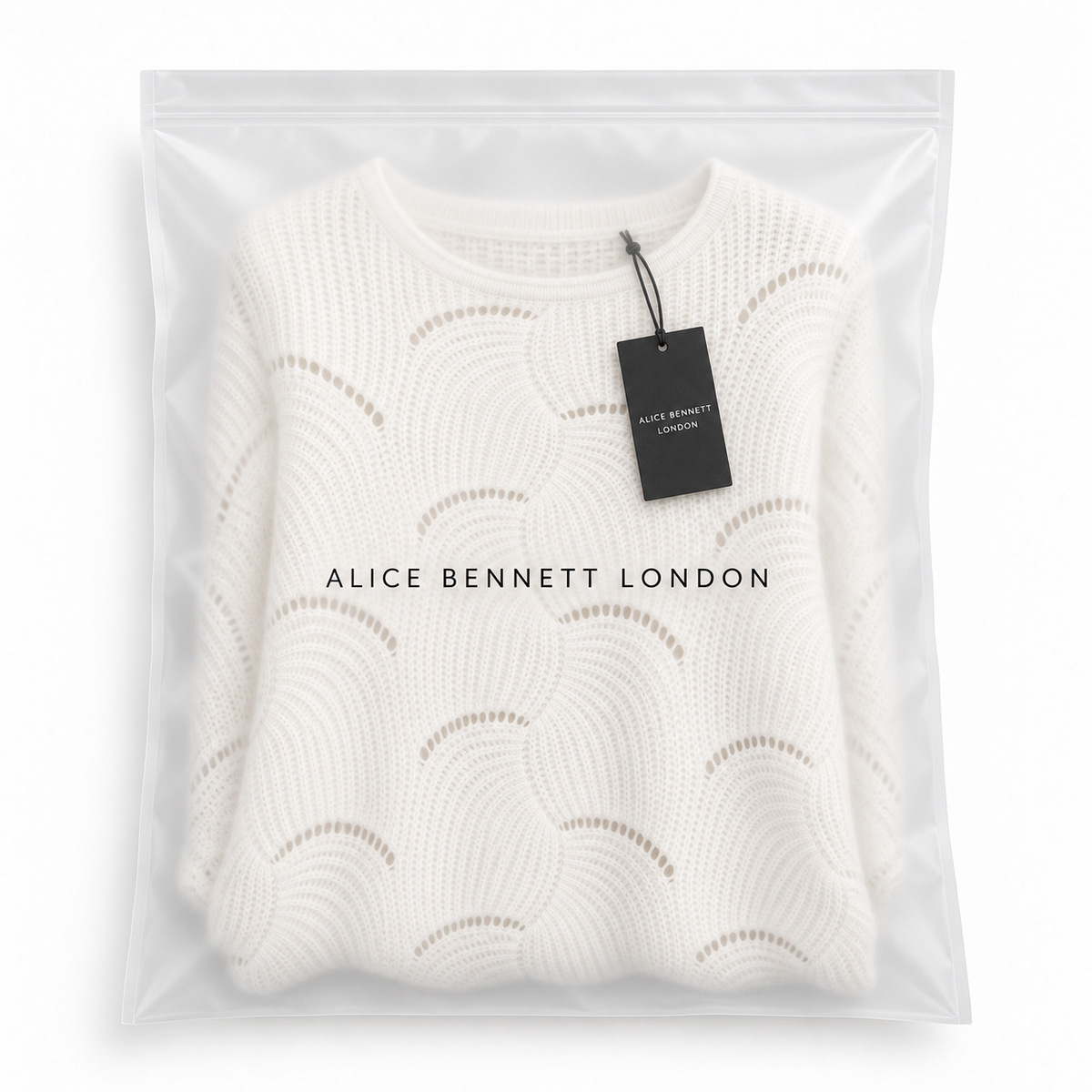 Coravina textured open-knit jumper in Alice Bennett London packaging with hangtag