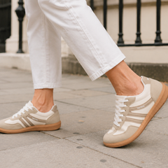 Woman wearing Deliza orthopaedic trainers in off-white and beige