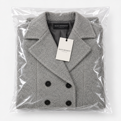 Folded grey longline coat in Alice Bennett London packaging
