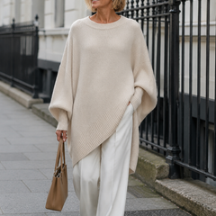 Woman wearing the oversized beige Emma sweater in London