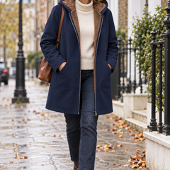 Woman wearing the Evelyn sherpa-lined hooded coat on a London street