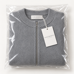 Evelyn soft grey zip-up cardigan folded in Alice Bennett London packaging