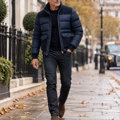 Man wearing the Matuidi navy quilted puffer jacket while walking in London