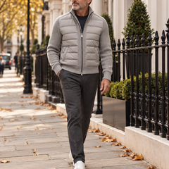 A man wearing the Kylian grey quilted knit jacket while walking in London