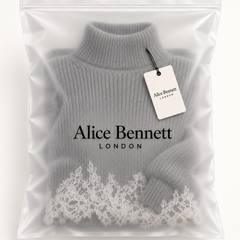 Grey lace-trim knit mini dress in Alice Bennett London packaging