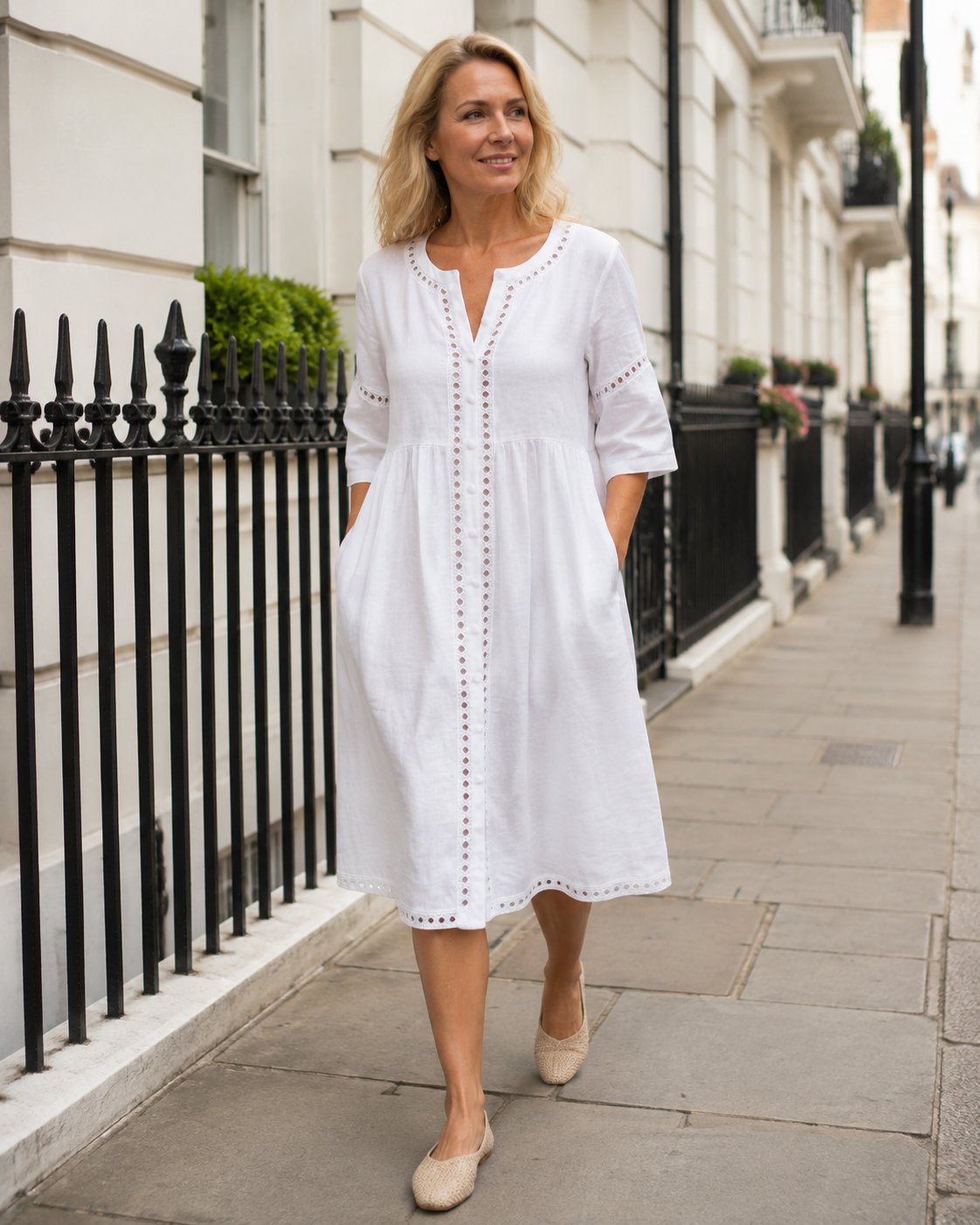 Woman wearing the Harlow premium linen midi dress on a London street