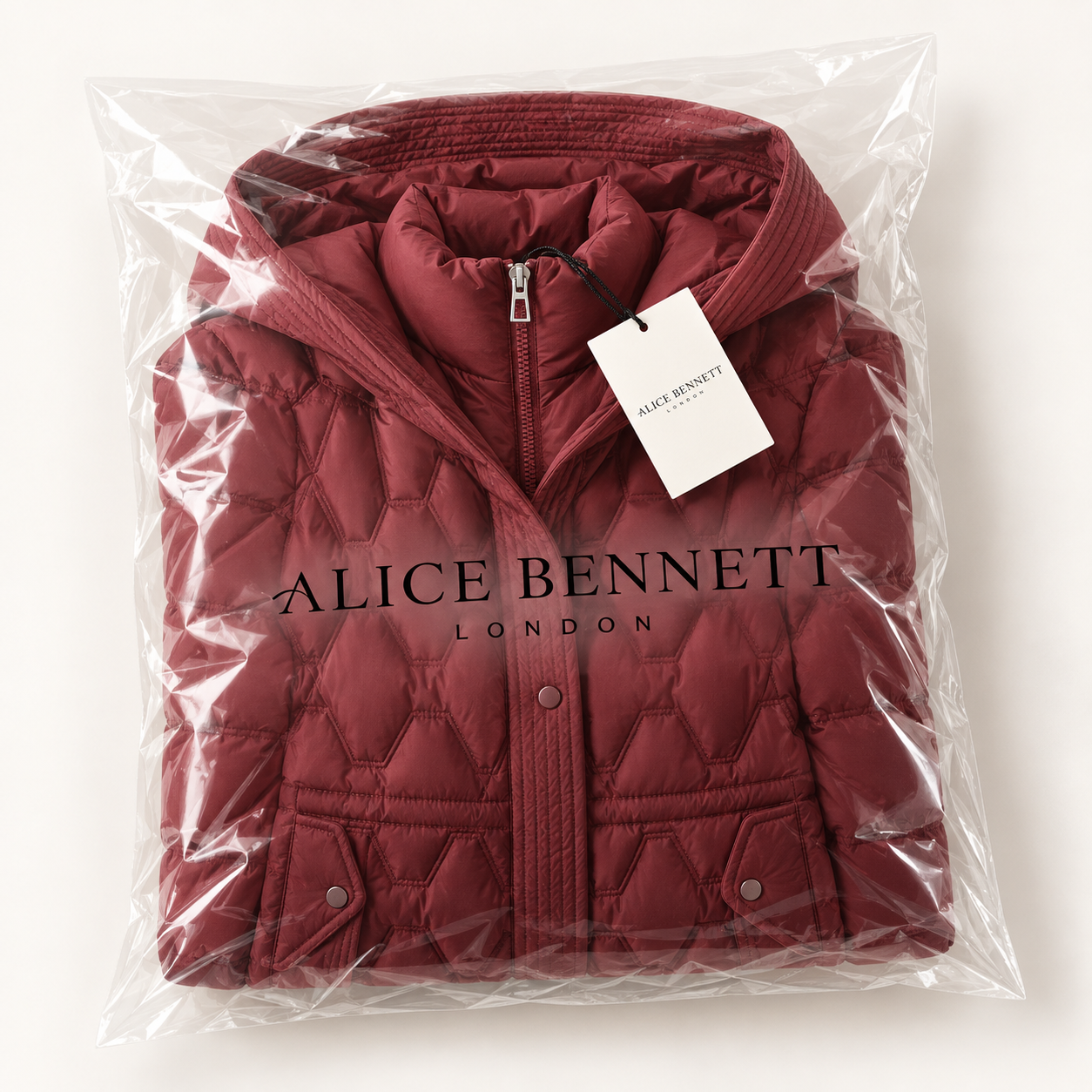 Helen longline hooded down coat in Alice Bennett London packaging with hangtag