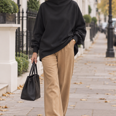 Isabella high-neck relaxed sweater worn by a woman in London