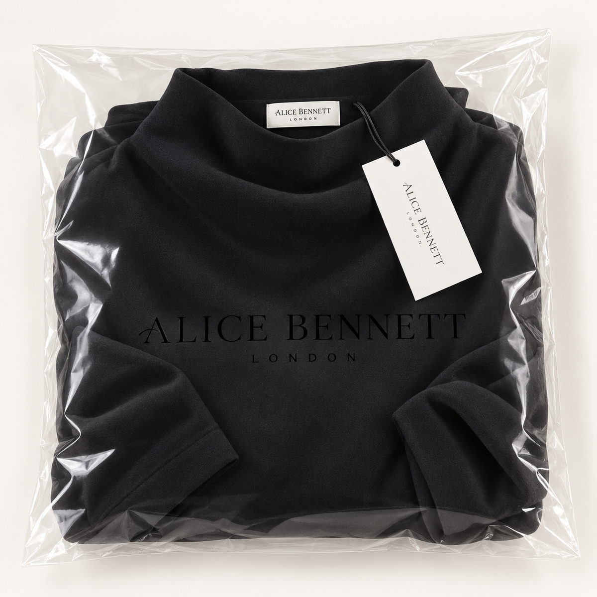 Isabella high-neck relaxed sweater in Alice Bennett London packaging with hangtag and neck label