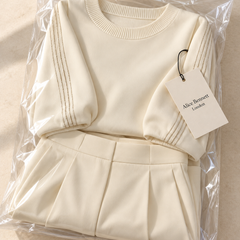 Mera ivory soft-touch trouser set in Alice Bennett London polybag
