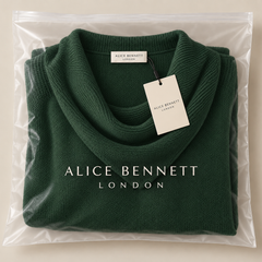 Green cowl-neck sweater in Alice Bennett London packaging