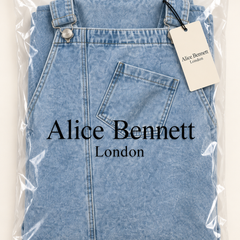 Susan light-wash denim pinafore maxi dress in Alice Bennett London packaging