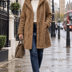 Woman aged 50 to 55 wearing the Textured Teddy Sherpa Hooded Jacket while walking in London