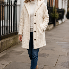 Wearbella cable-knit hooded longline coat worn by a woman in London