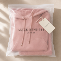 Wearbella rose hooded cape and wide-leg trouser set folded in a matte semi-transparent Alice Bennett London polybag with hangtag
