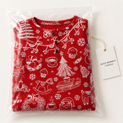 Red Christmas graphic pullover sweater in Alice Bennett London packaging